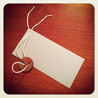 thread floss for loop on hand made gift tag